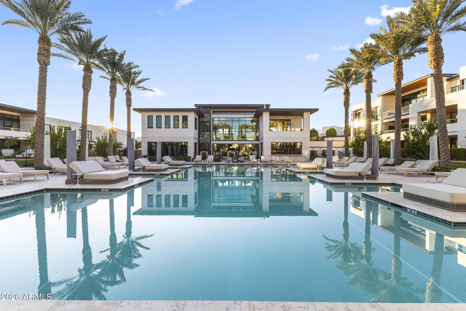 Resort-style community pool at twilight at a Paradise Valley residence